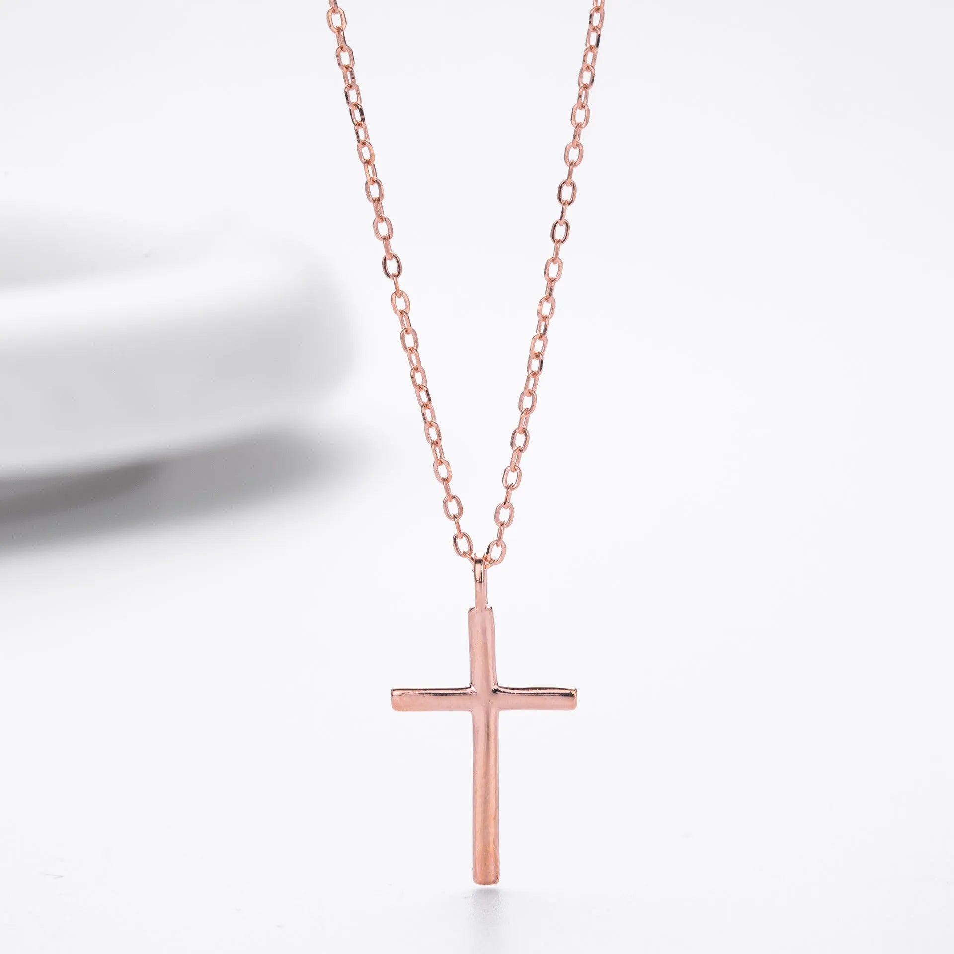 Sterling silver cross pendant necklace on O-shaped chain with gold, platinum, and rose gold plating options