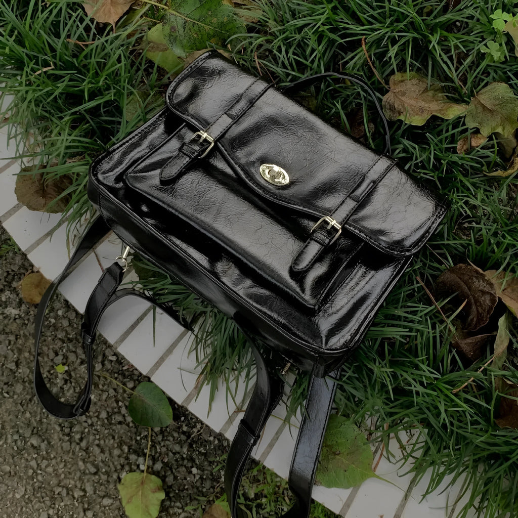 Black college style messenger bag made from PU leather with oil wax finish