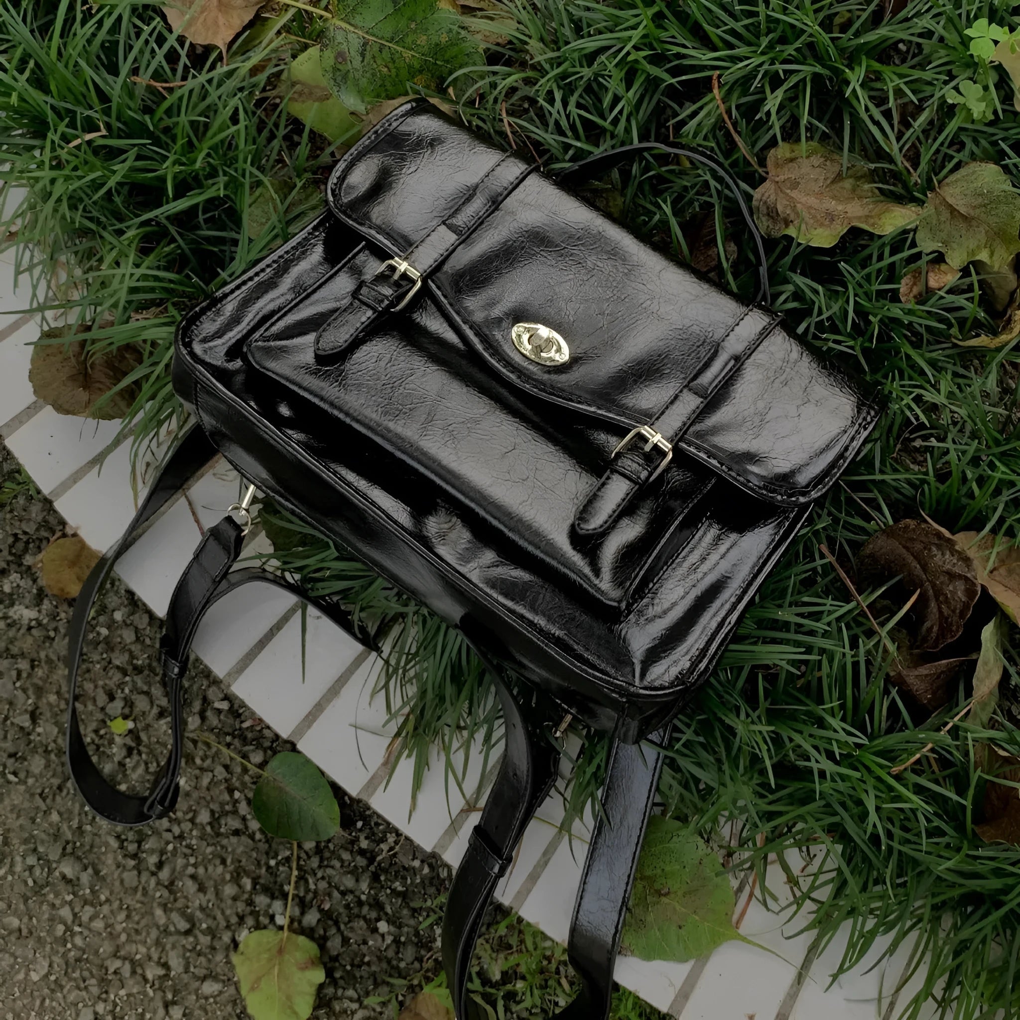 Black college style messenger bag made from PU leather with oil wax finish