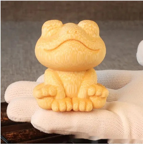 Solid bamboo smiling frog carving ornament measuring 5cm height with cartoon style design