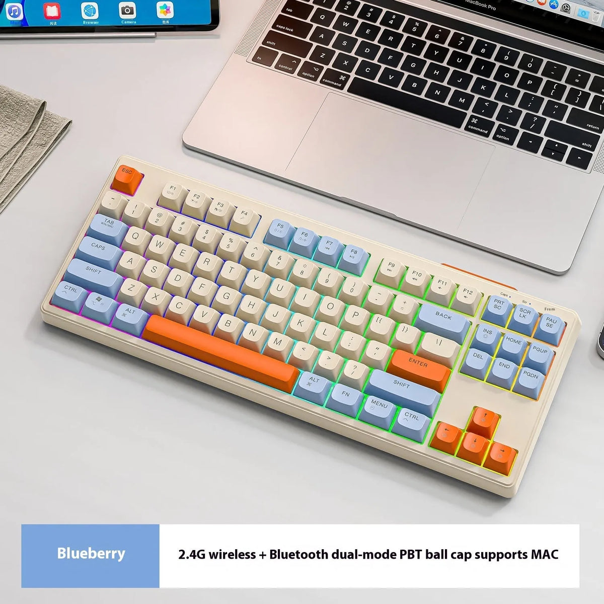 Free Wolf M87 wireless Bluetooth dual-mode mechanical feel keyboard in one of four colour options on a desk.