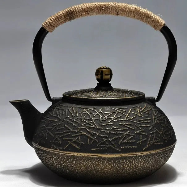 Japanese style cast iron teapot with 0.9 litre capacity shown in a bronze finish.