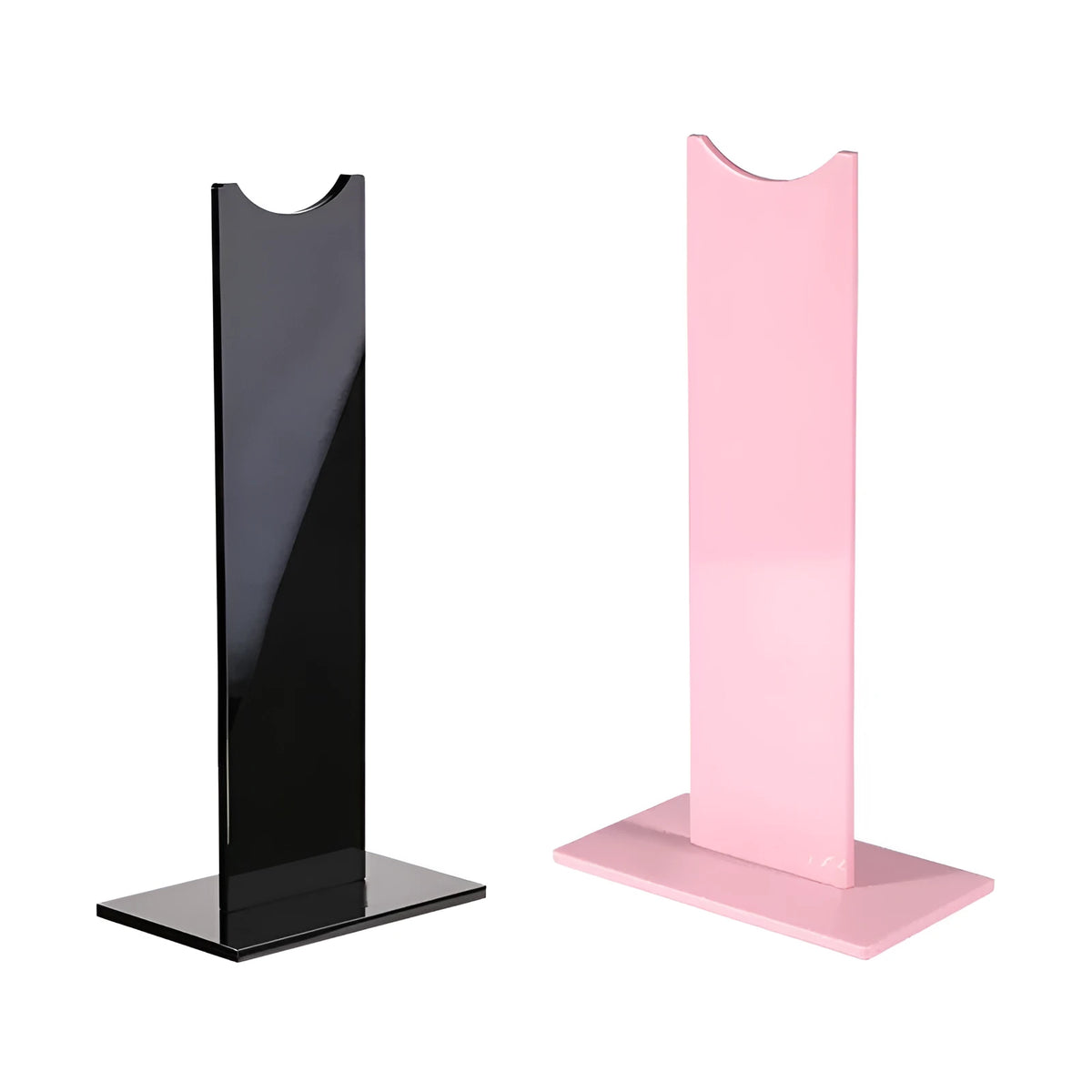 Pink detachable gaming headset stand with non-slip silicone base on a desk