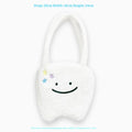 White plush tote bag with cute tooth pattern, zipper closure, and shoulder strap