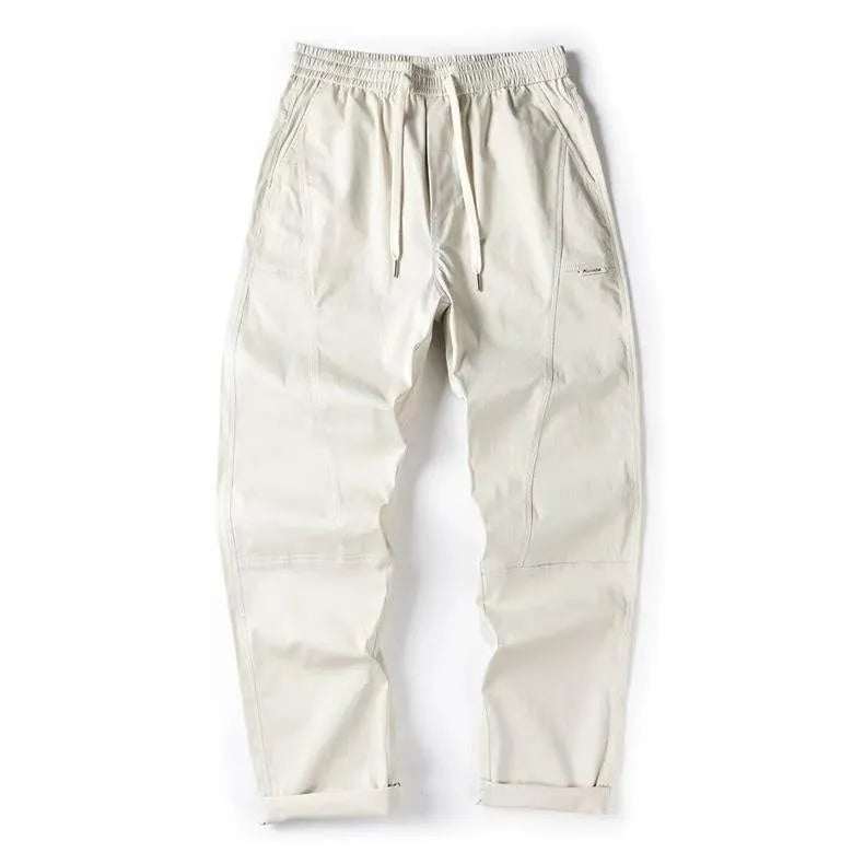Cotton wide-leg casual trousers in milky white and black colours, showcasing the relaxed fit.