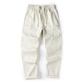 Cotton wide-leg casual trousers in milky white and black colours, showcasing the relaxed fit.