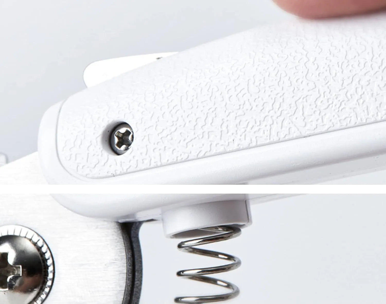 White pet nail clippers with LED light, transparent guard, and a nail file on a table