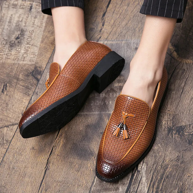 Men's black pointed toe slip-on loafers with a tassel detail on the artificial PU upper.