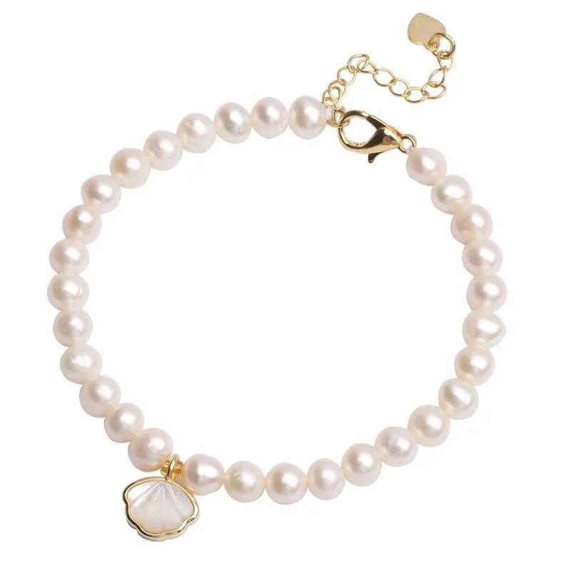 Women's freshwater pearl bracelet with fan-shaped design showing elastic and chain fastening options