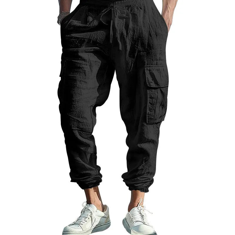 Men's solid colour linen casual trousers with ankle ties and a drawstring waist.