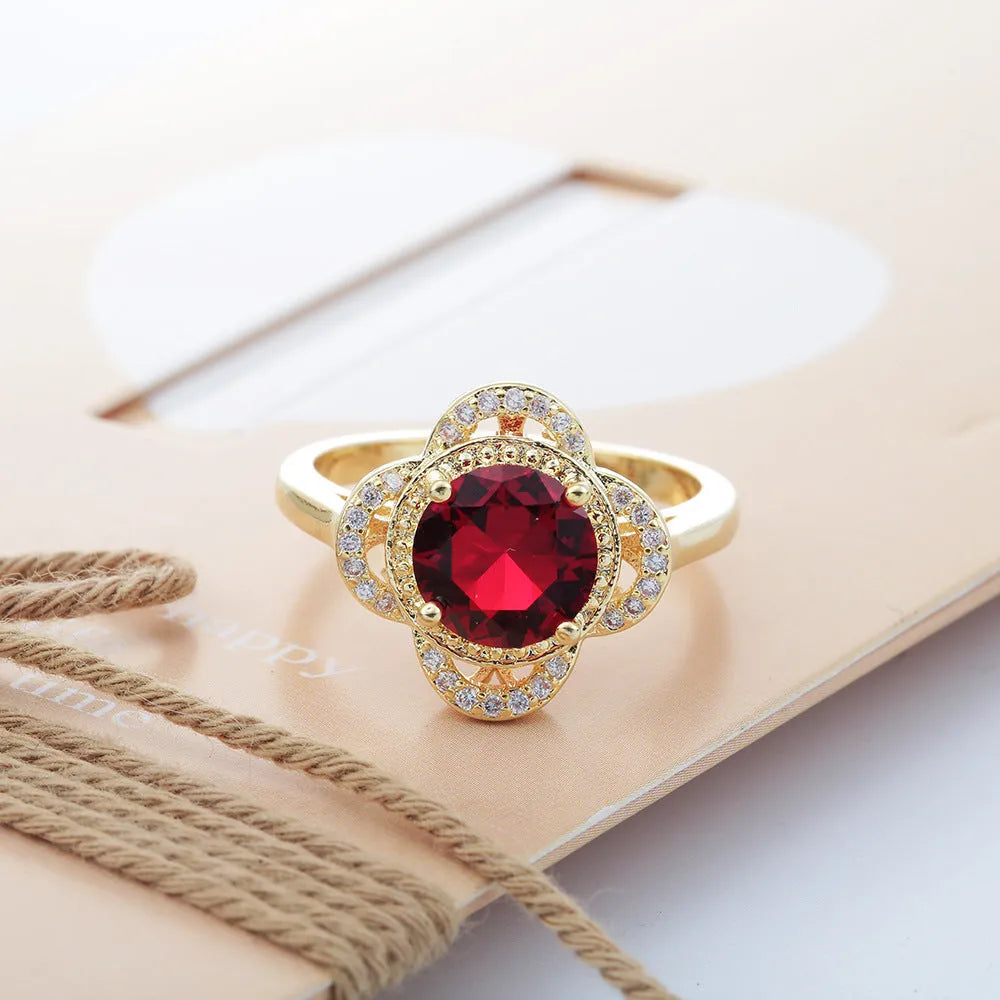 Copper ring with zircon stone inlaid in a fruit-shaped design.