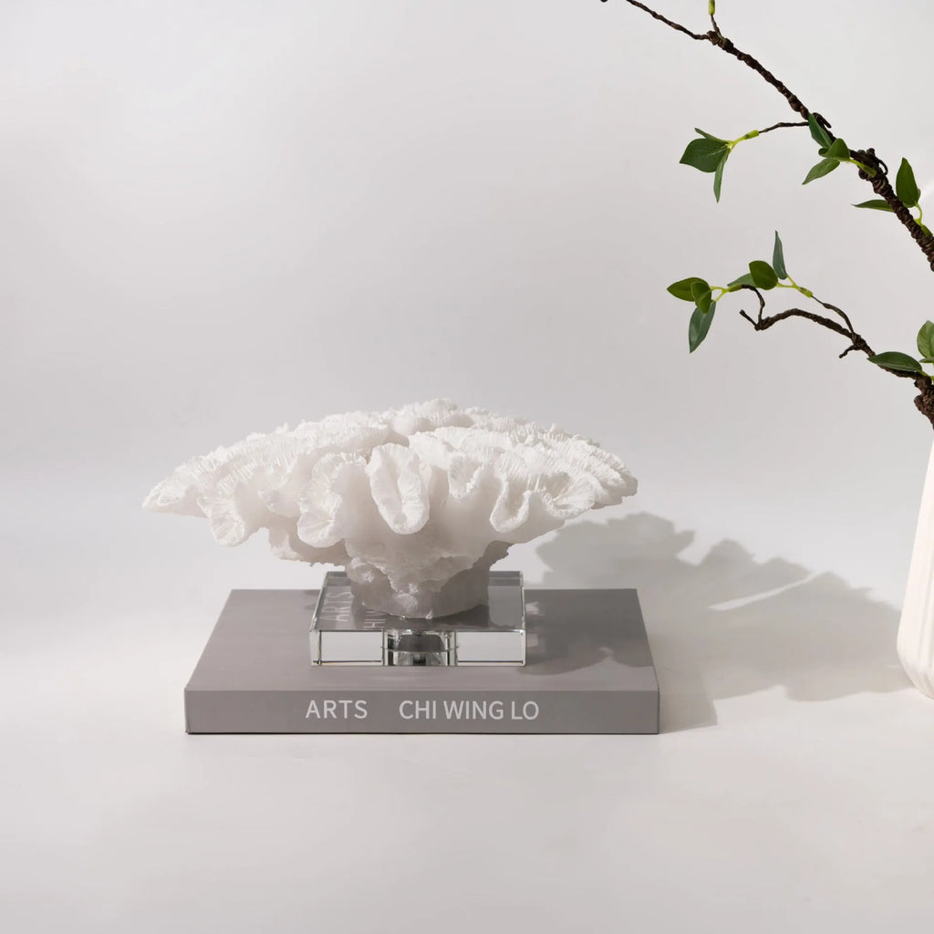 Resin coral ornament in coral colour, 34x31x15cm, on a wooden desktop
