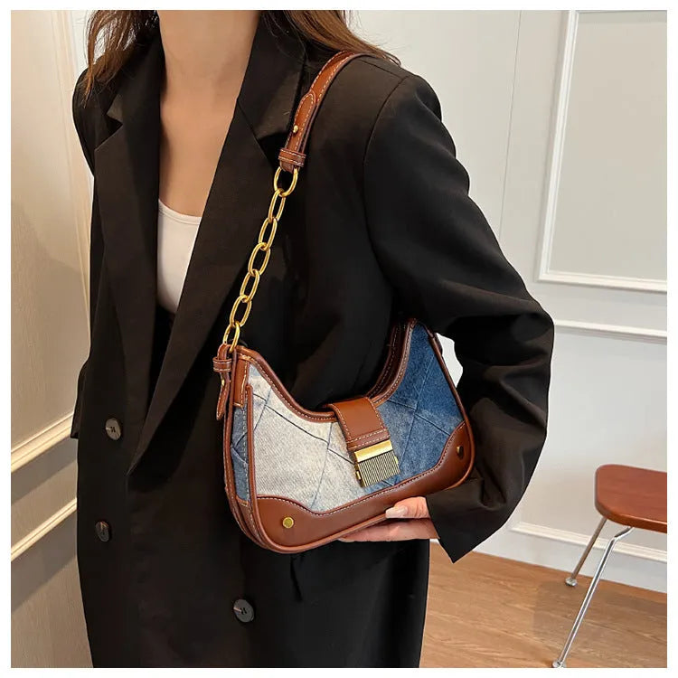 Brown denim bucket shoulder bag with diamond mesh panels and metallic chain strap