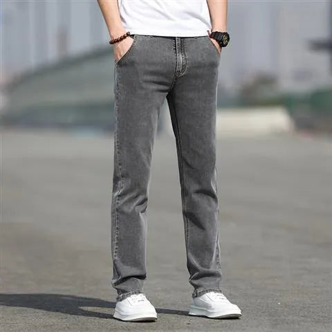 Men's smoky grey straight leg jeans with low waist design and zipper fly closure