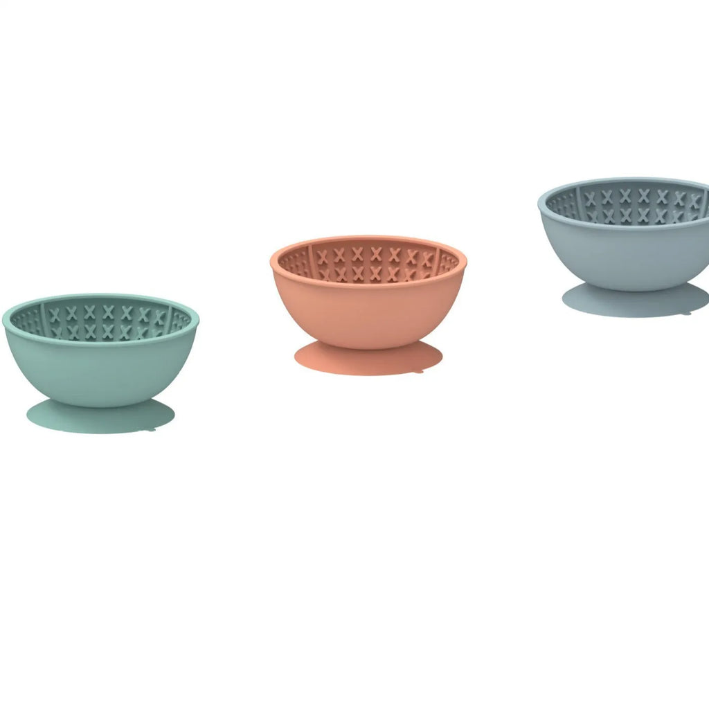 Cyan silicone pet bowl with textured licking mat surface and suction cup base for slow feeding