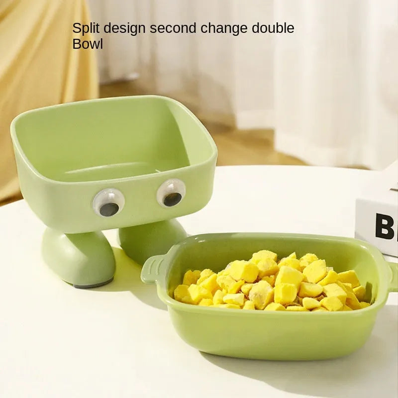 Green robot-shaped elevated cat bowl with 15-degree tilt and detachable inner dish