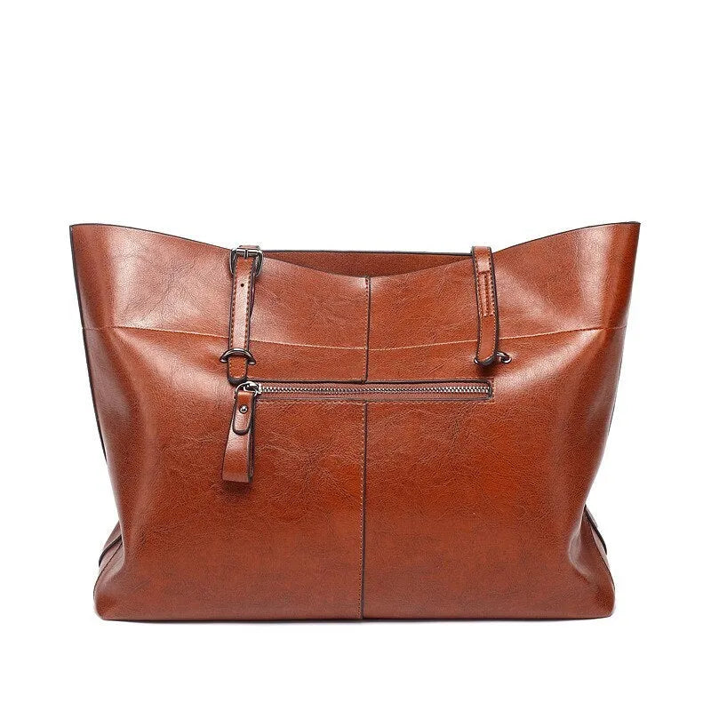 Women's wax cowhide leather crossbody handbag in five colour options showing two compartments and phone pocket.
