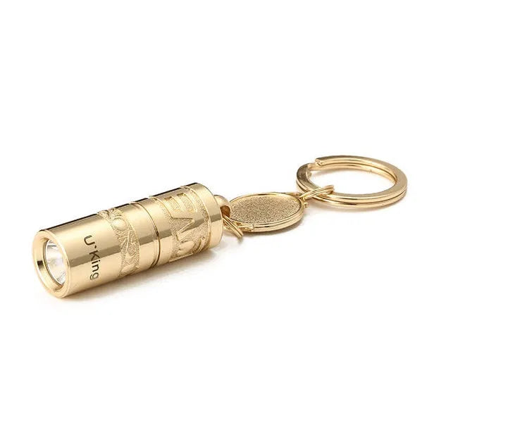 Gold zinc alloy mini LED keychain flashlight with a waterproof case and emergency light function.