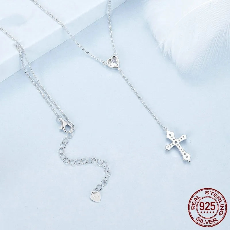 Silver necklace with a small cross pendant on an O-ring chain, shown in colour BSN384.
