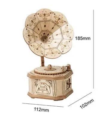 Four wooden 3D puzzle models showing an Airship, Balloon, Radio, and Pumpkin Carriage