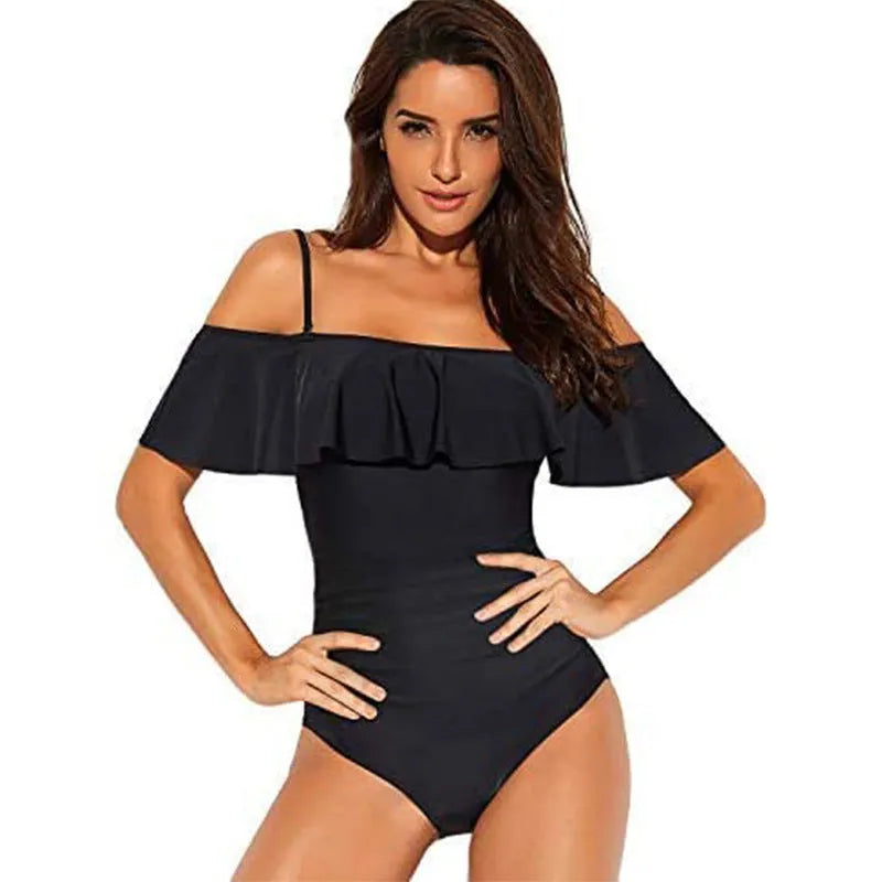 Black one-piece swimsuit with side cut-out detail and ruffled tube top straps.