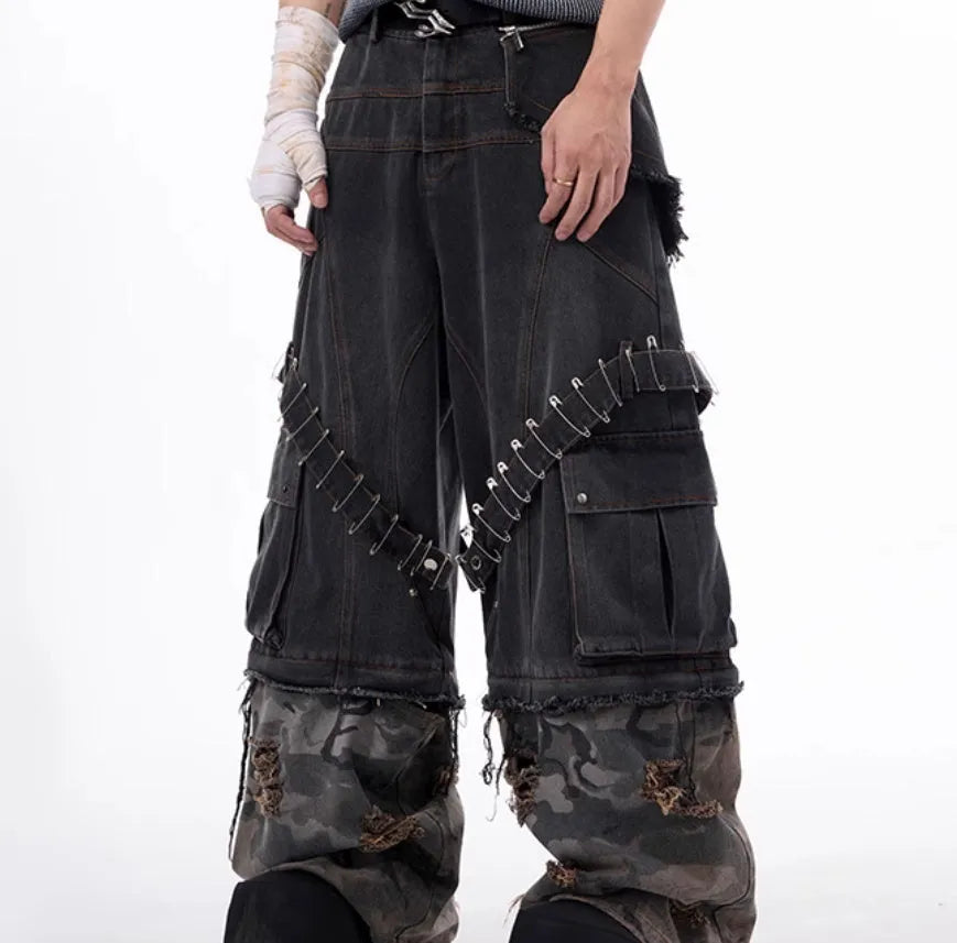 Grey men's camouflage jeans with splicing construction and pin details on cotton denim fabric
