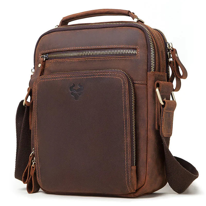 Men's brown Crazy Horse leather crossbody bag with single shoulder strap showing visible sewing lines