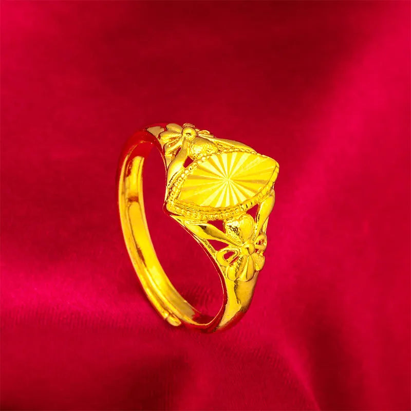 Gold open diamond flower ring with geometric floral pattern and textured brass construction