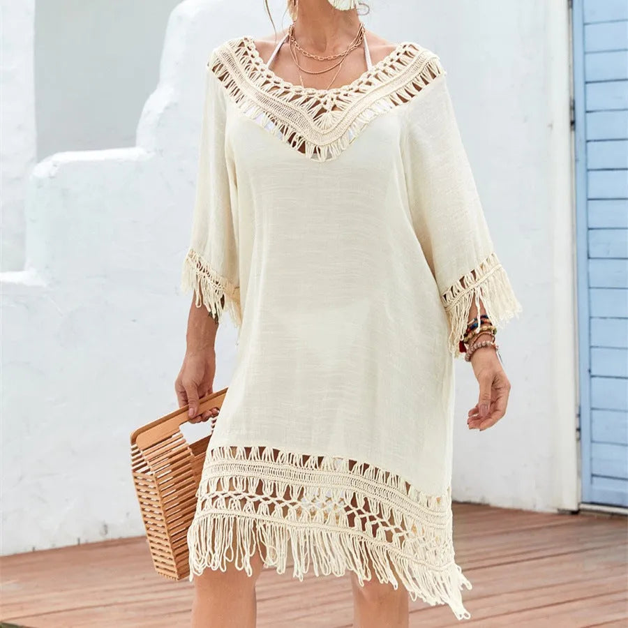 Apricot crocheted patchwork beach dress with half sleeves and mid-length cut on mannequin