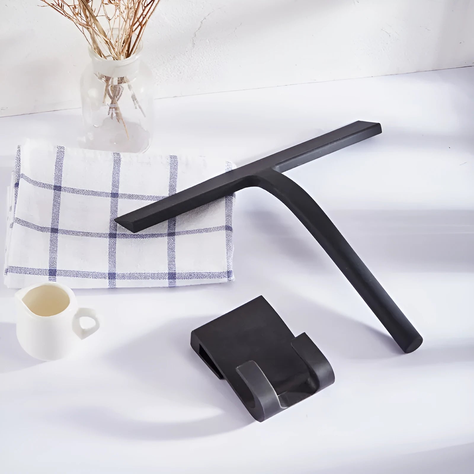 Silicone body wiper 22.8cm with metal-reinforced handle and hanging hook, black colour on glass surface