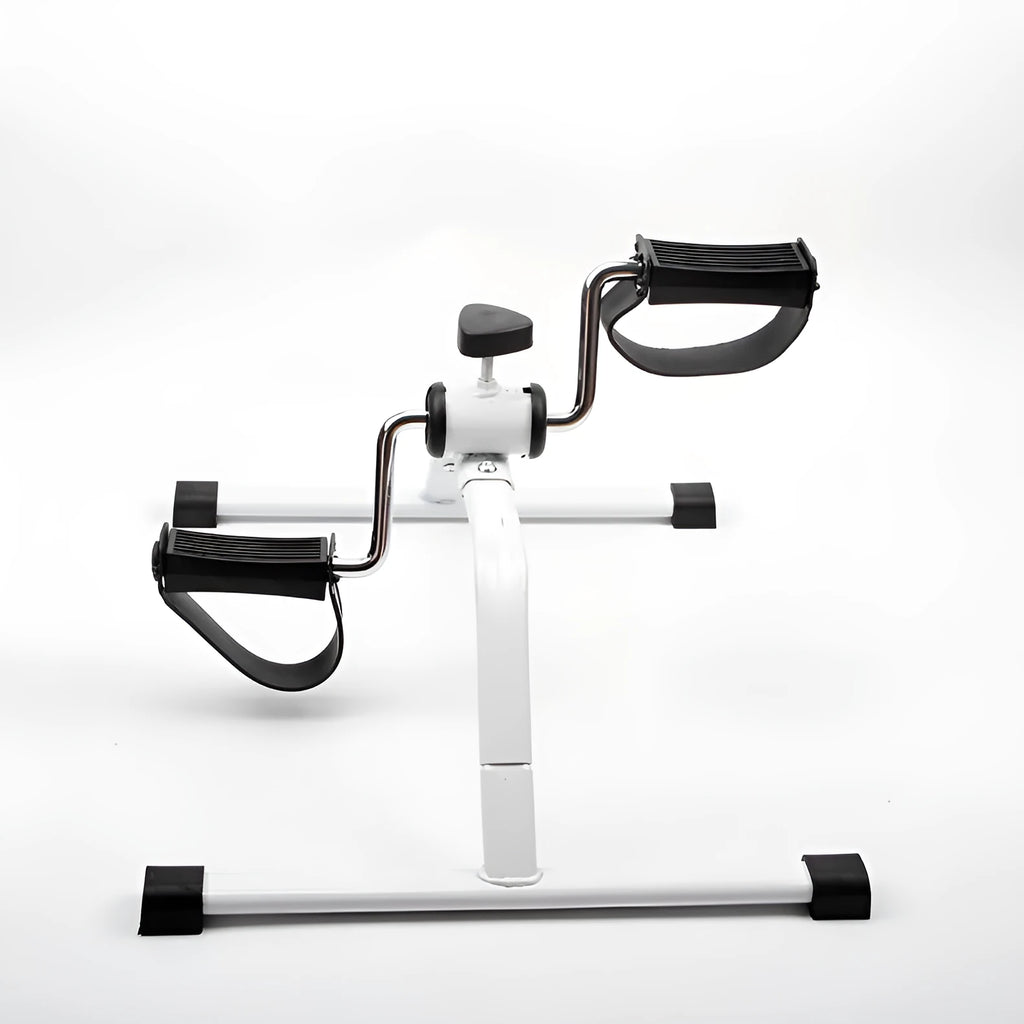 White mini exercise bike with non-slip pedals and monitor on rubber feet