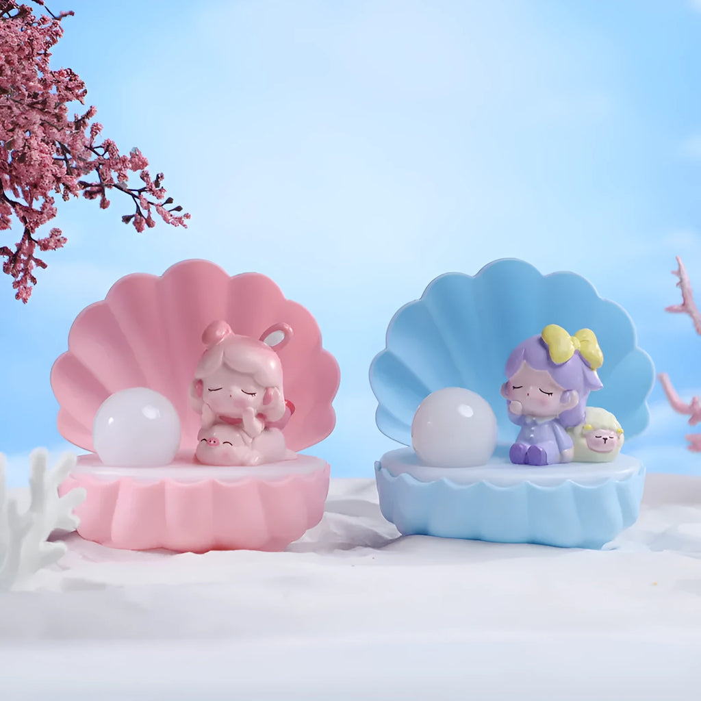 Resin cartoon small night lamp with pink pig girl design on a table