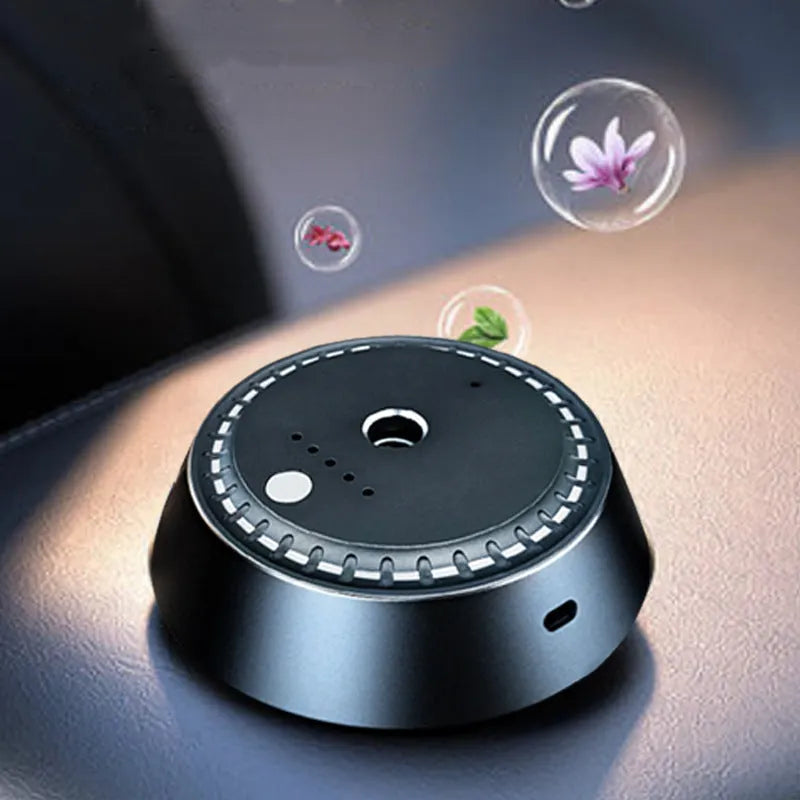 Black metal USB rechargeable car aroma diffuser with 30ml tank on a car dashboard.