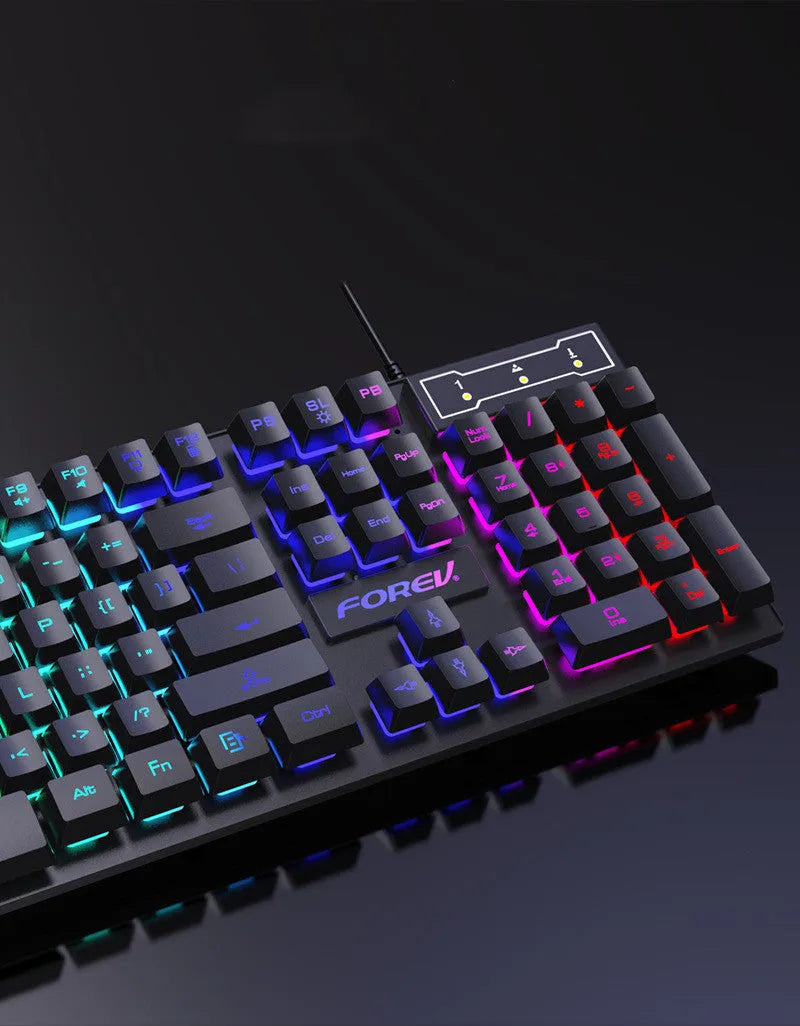 Four piece wired keyboard mouse headset set with mouse pad on desk