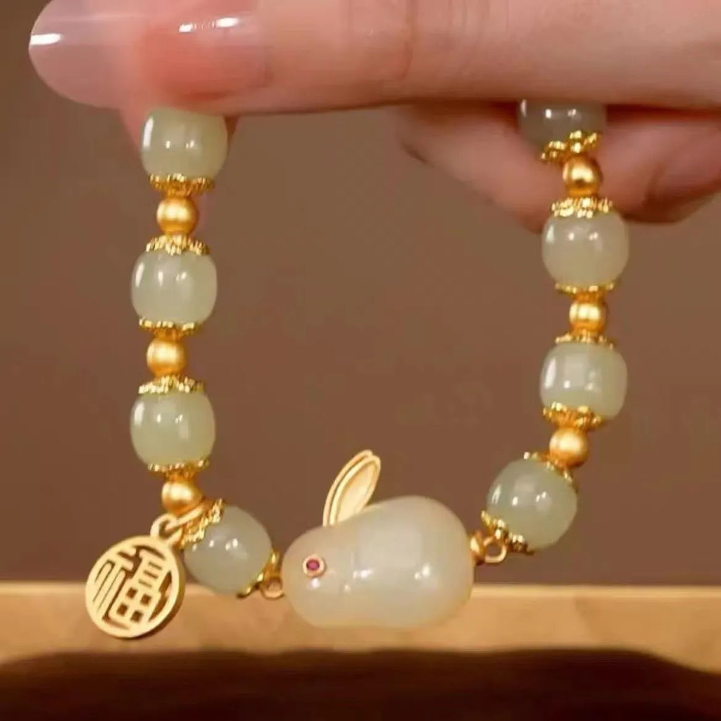 Green jade and black cord women's bracelet with fu character and hare pendant charms