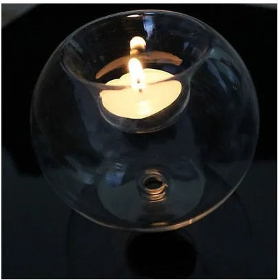 Clear round hollow glass candle holder handmade using hot glass frying table technique