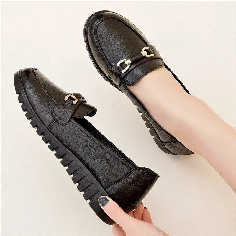 Black women's microfibre slip-on pumps with a round toe and low flat heel on a rubber sole.