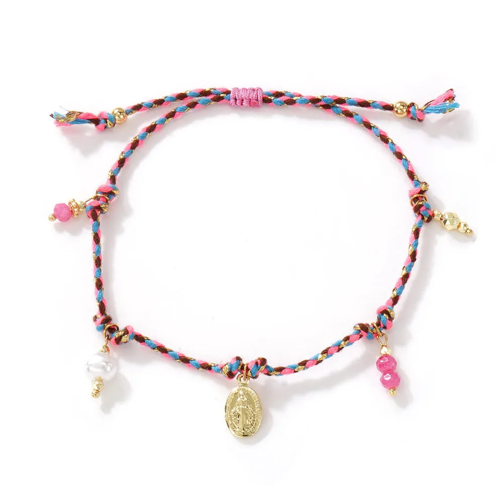 Close-up of a colourful hand-woven braided rope bracelet styled as an ethnic accessory for women.