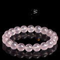 Natural starlight crystal round bead bracelet in pink with polished beads in multiple size options