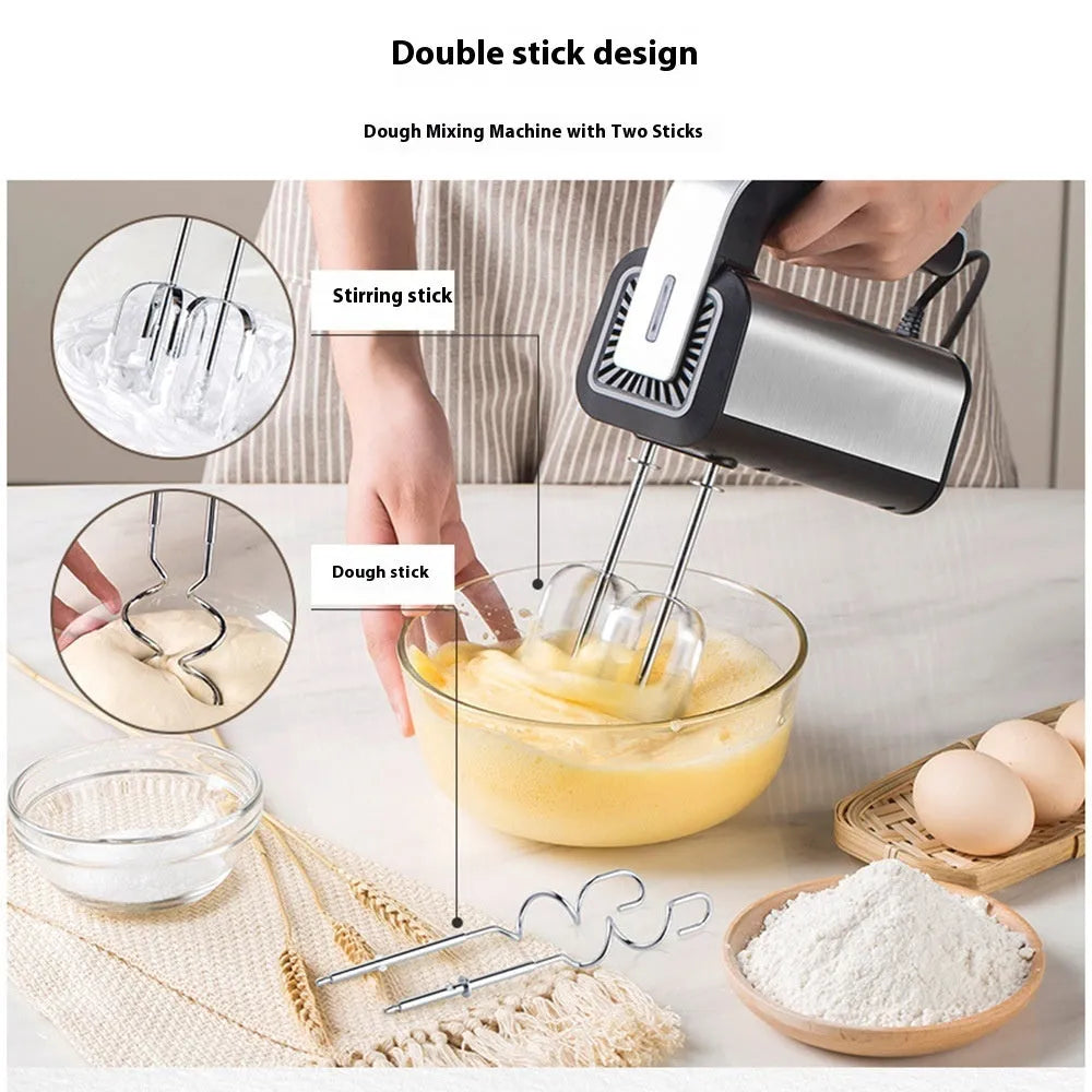 Silver handheld electric kitchen whisk with beaters on a countertop