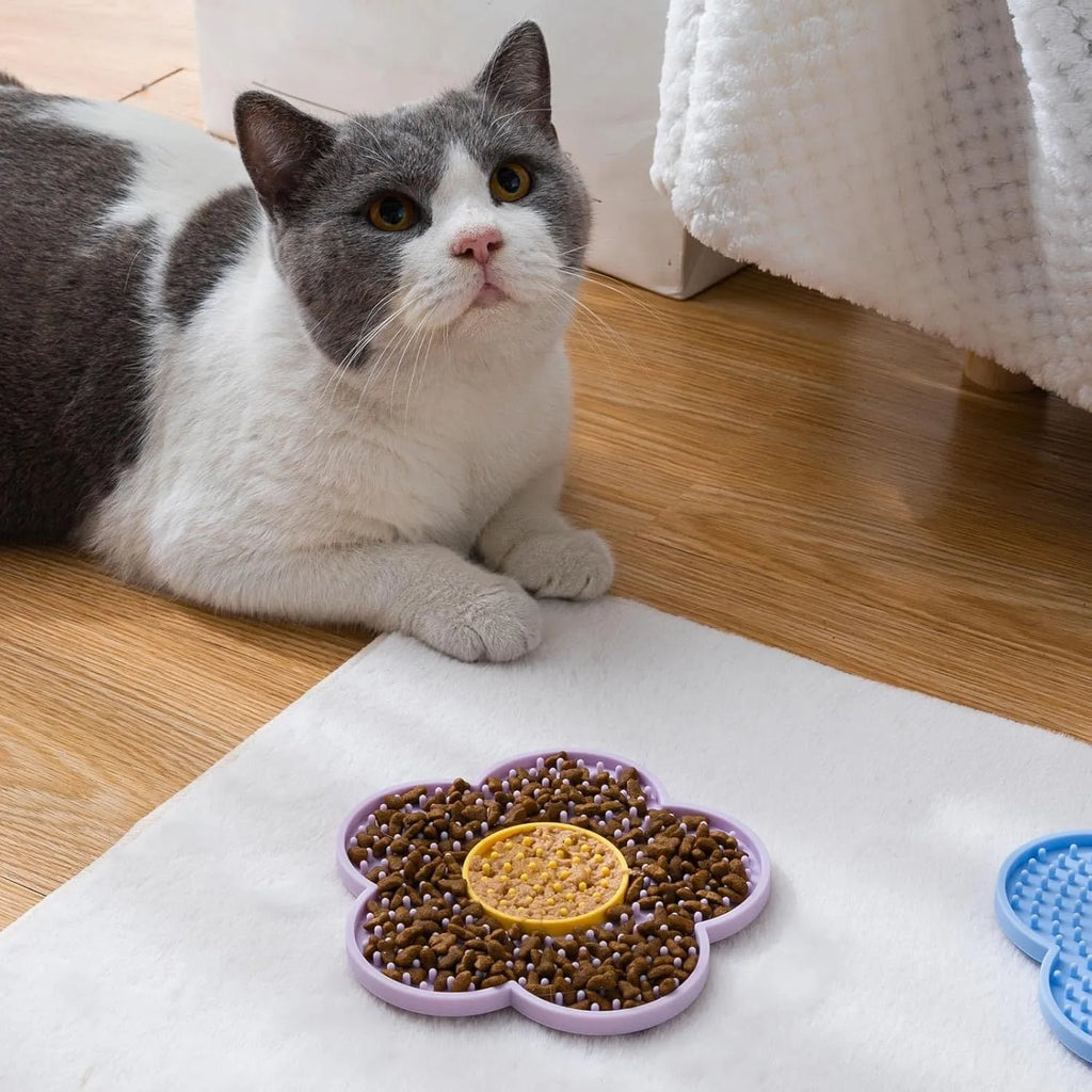 Flower-shaped silicone pet licking mat with suction cups in blue, grey, pink, purple, or red.