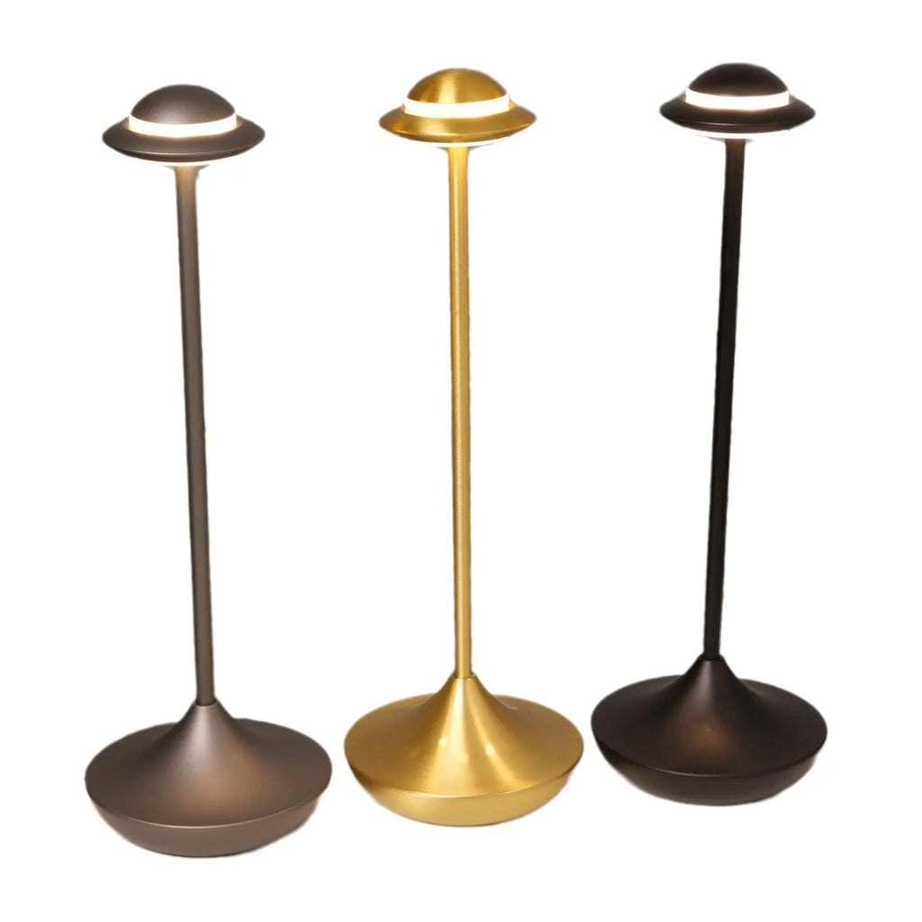 Modern UFO-shaped rechargeable table lamp in gold, grey, or black with touch dimming controls.