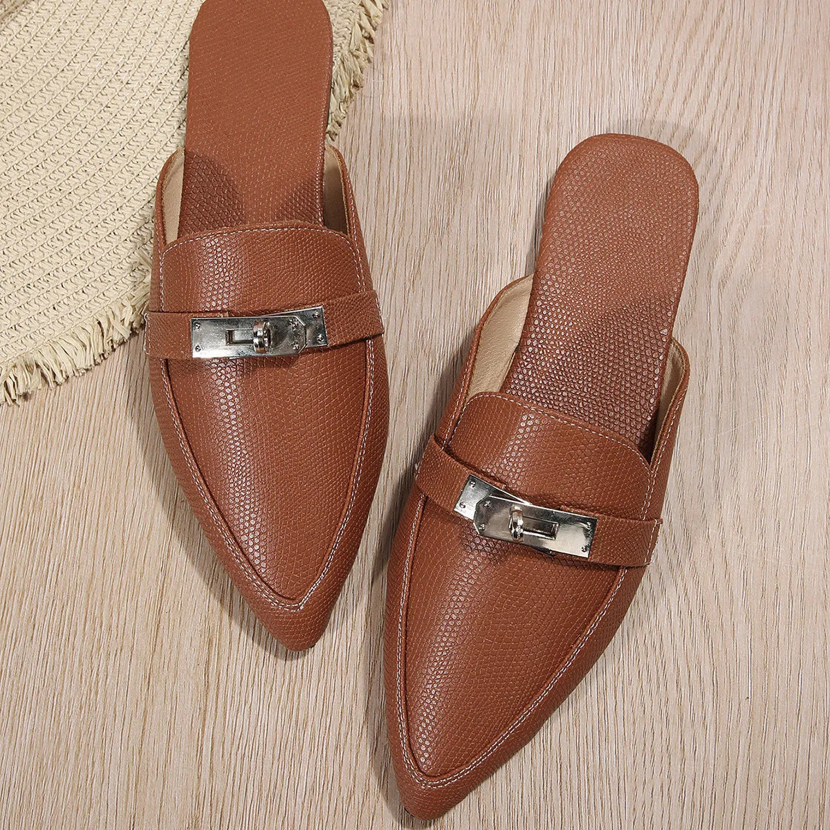 Light brown women's pointed-toe low heel semi-slippers with a rubber sole.