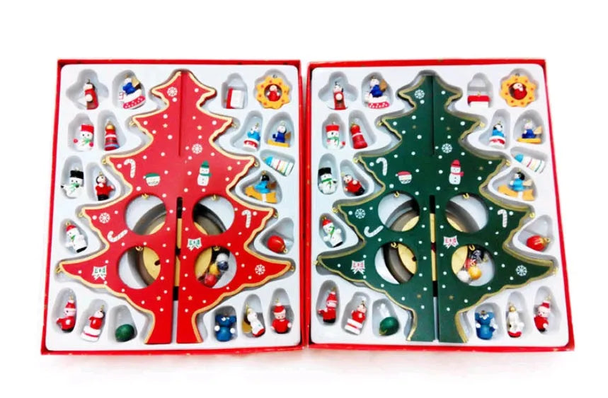 Hand painted wooden Christmas tree decorations in red and green colours on desktop