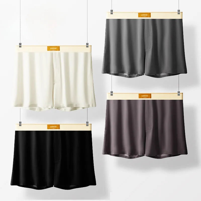 Men's solid colour ice silk loose fit boxer shorts on a white background.