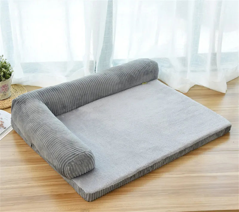 Corduroy pet dog bed sofa with removable cover in a grey colour, shown in a living room setting.
