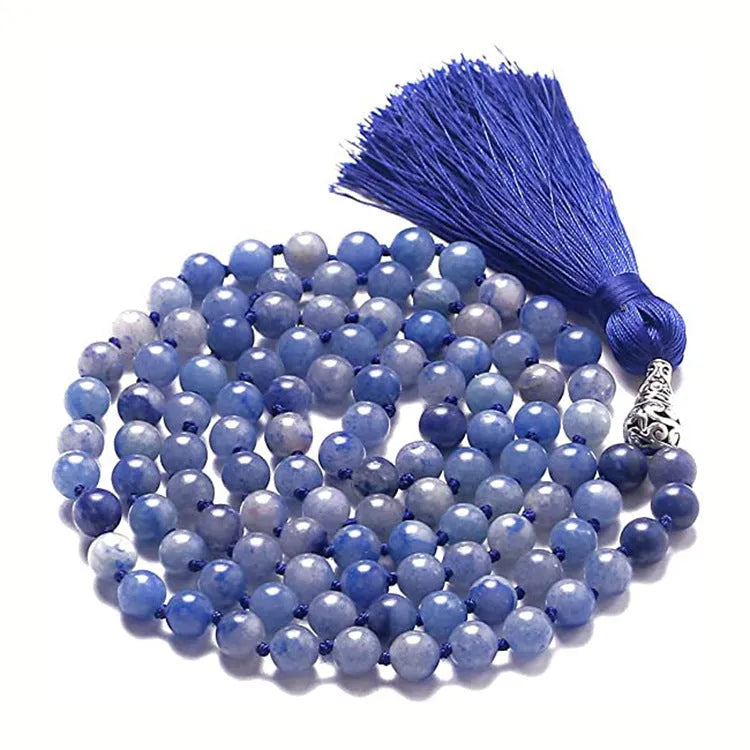 Long multicoloured agate tassel necklace with geometric beads and a flowing pendant.