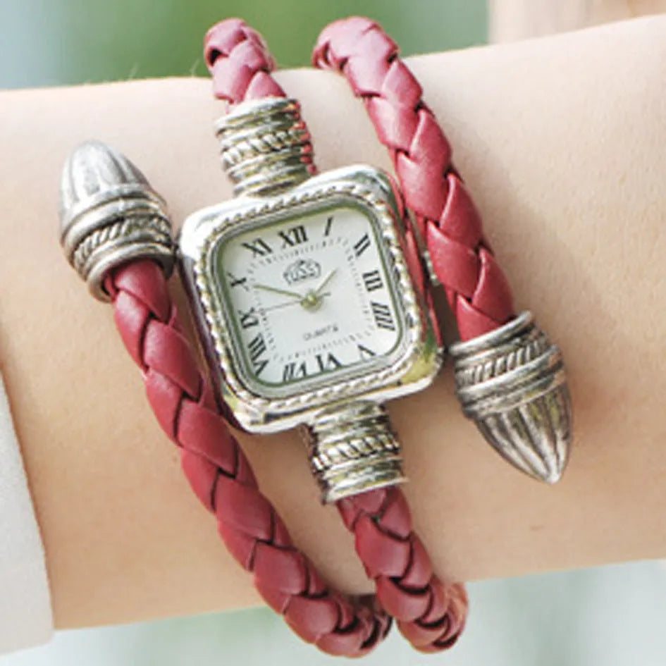 Snake bracelet quartz watch with leather strap and alloy buckle on a black background