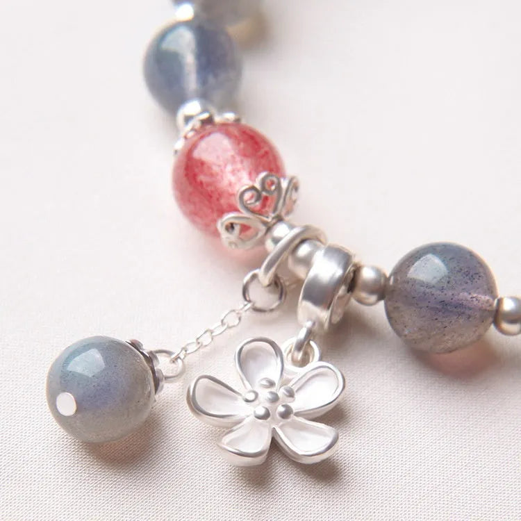 Grey moonlight crystal bracelet with Zodiac design, featuring 7.5mm moonlight lime and strawberry quartz stones on 925 silver.