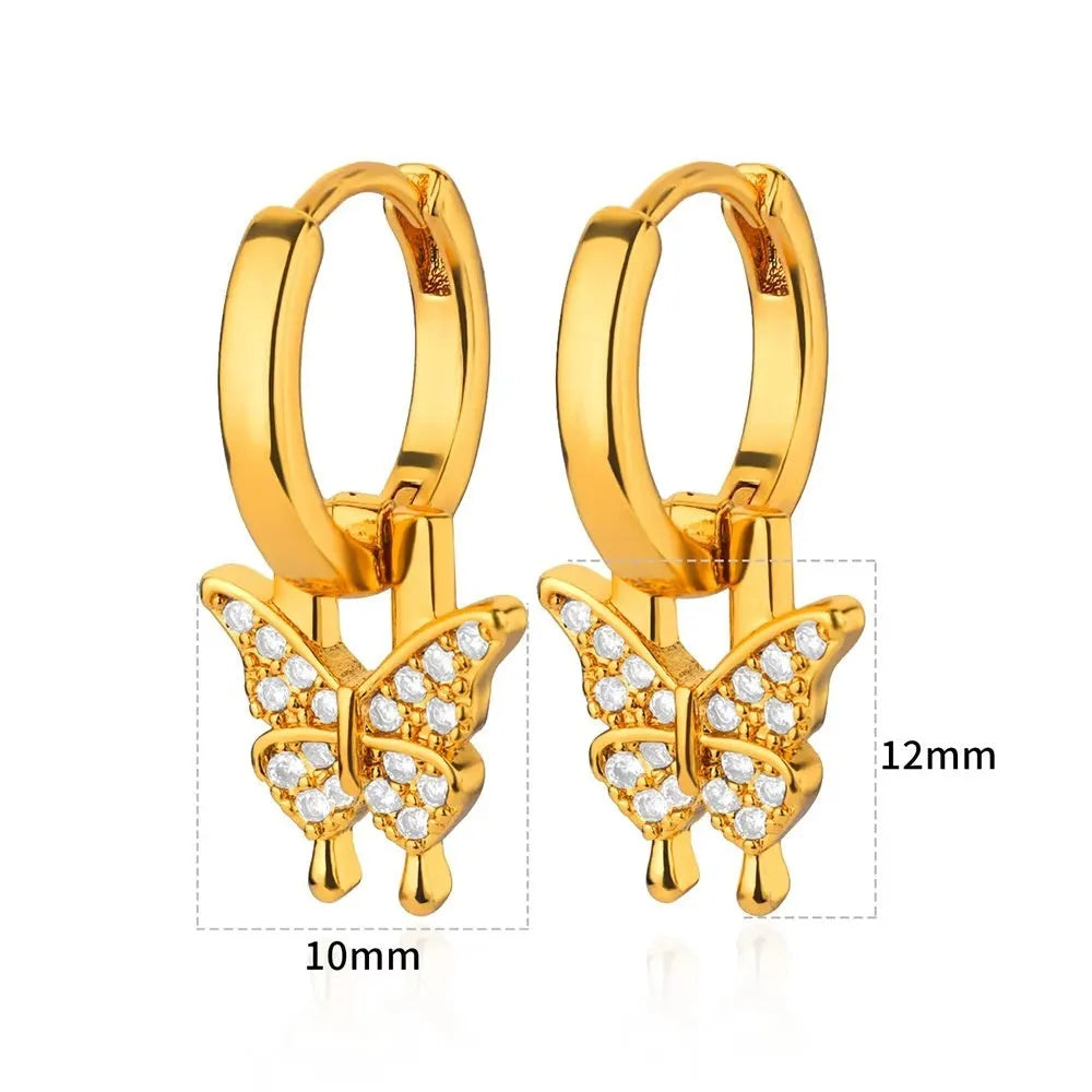 Women's irregular geometric butterfly earrings in copper with heart, bow and star motifs